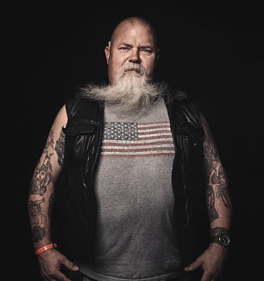 Older biker with beard wearing plain black leather vest – Biker Vest US